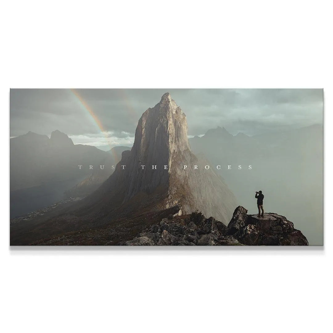 Wide-angle view of the dramatic mountain landscape canvas featuring the inspiring text 'Trust The Process'.