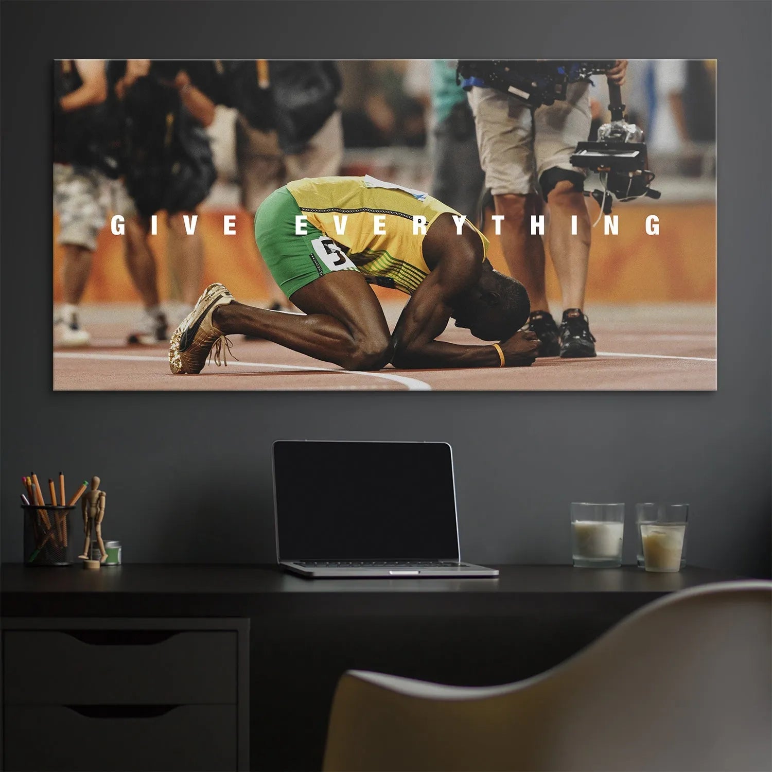Texture detail of the gold running spikes worn by Bolt resting on the track, featured prominently in 'Usain Bolt - Give Everything'.